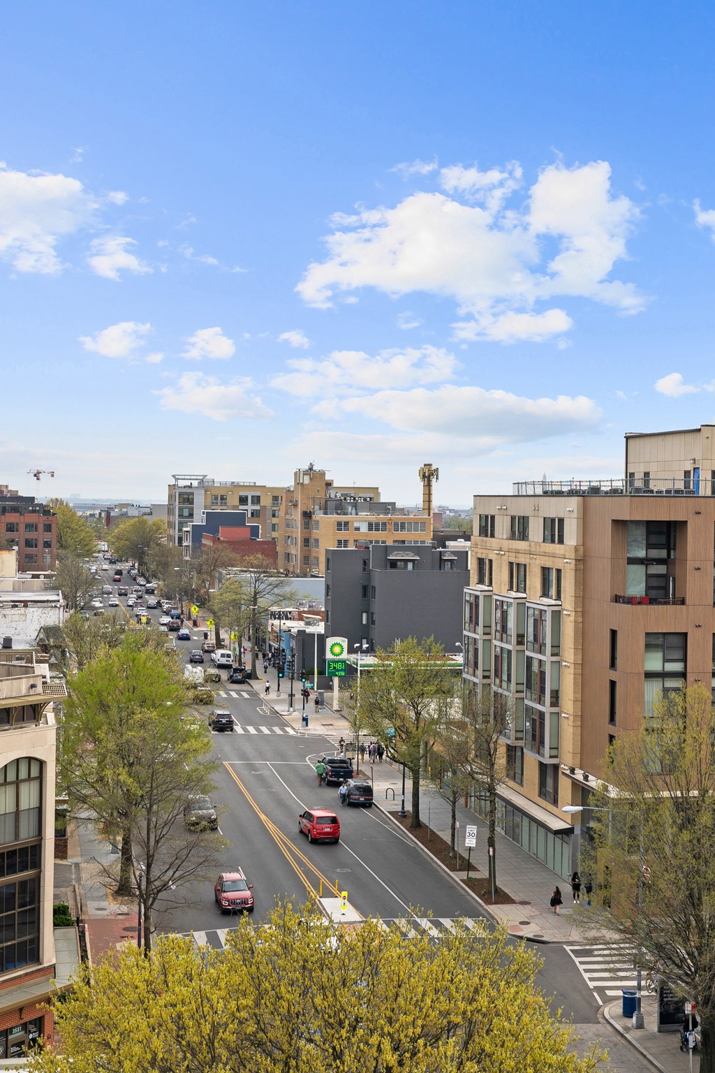 A city street with cars and buildings.