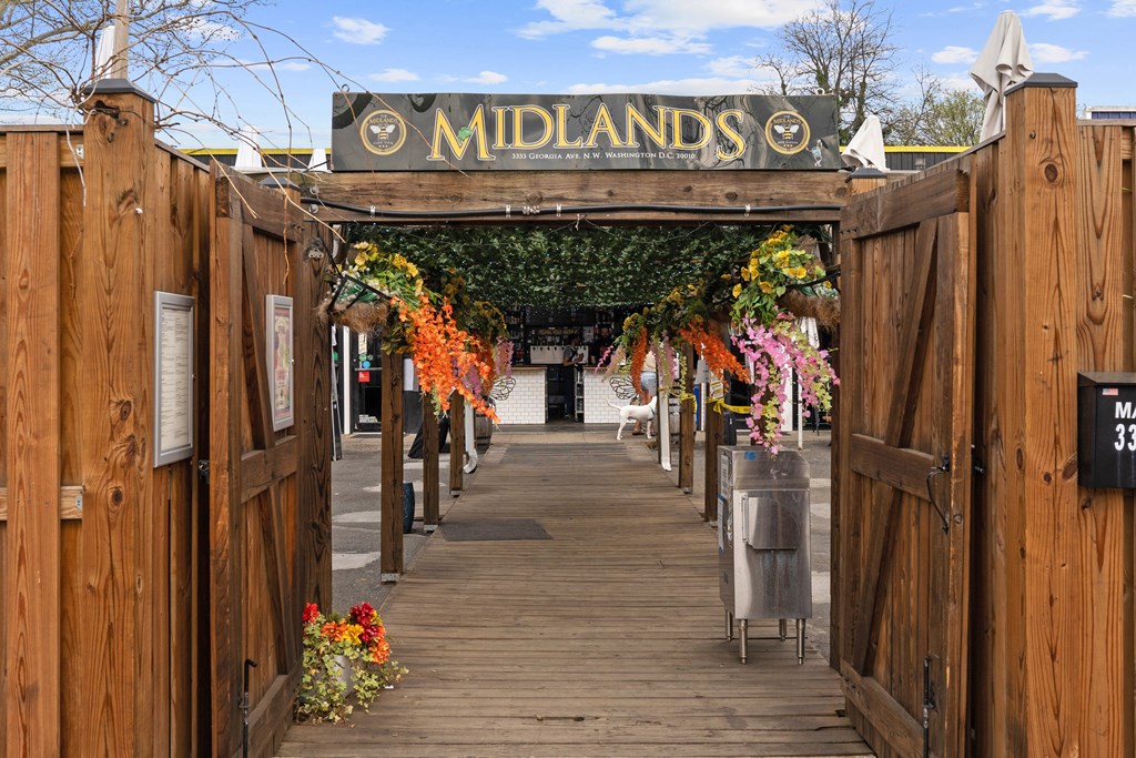 A wooden gate with Midlands written on it.
