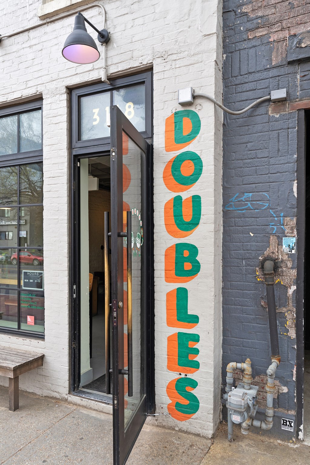A storefront with a door that says "DOUBLES" on it.
