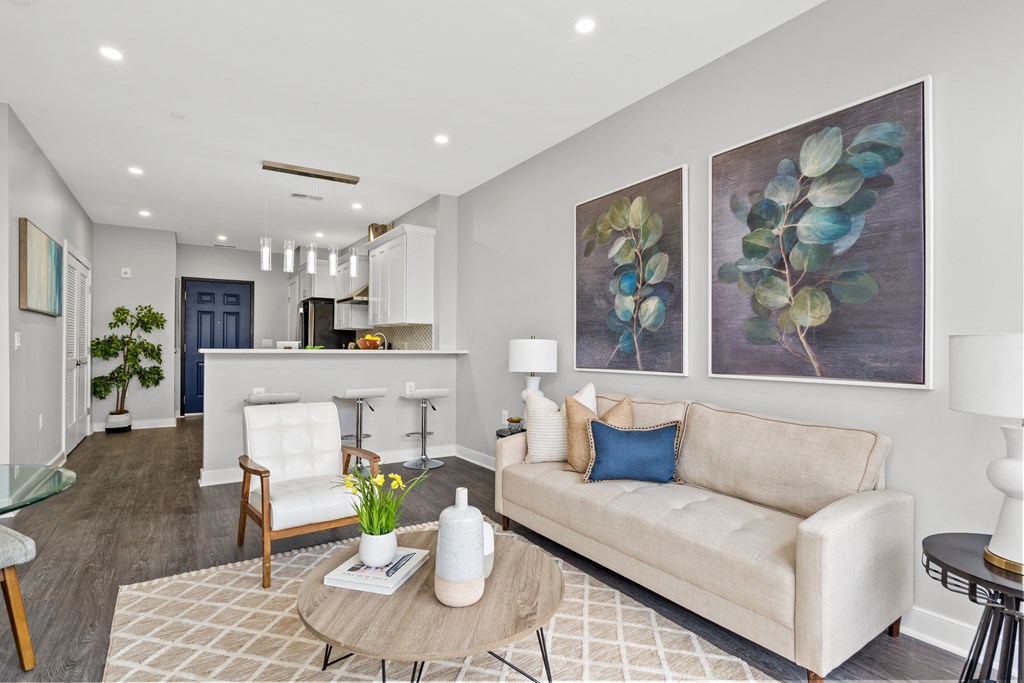 A living room with a couch, chair, and a coffee table.