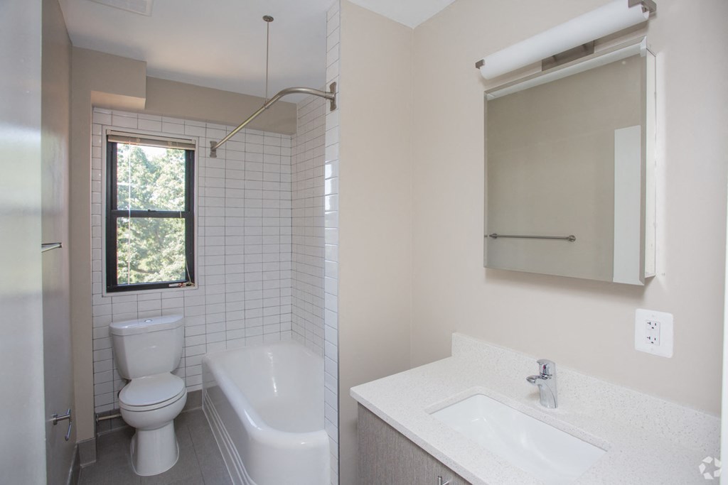 a bathroom with a toilet sink and bathtub
