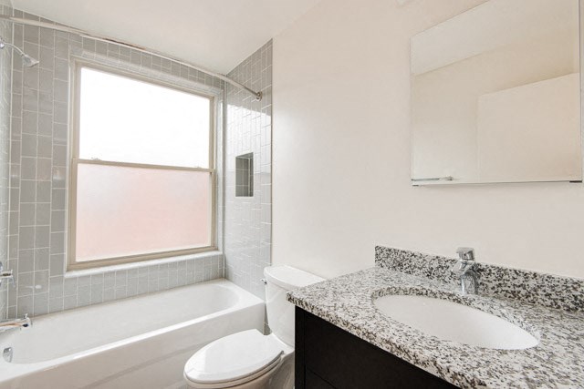 a bathroom with a sink toilet and bathtub