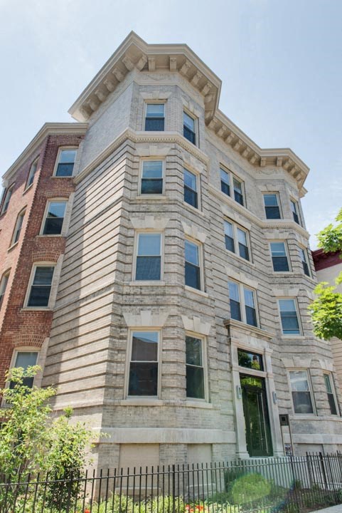 a tall building with a fence in front of it