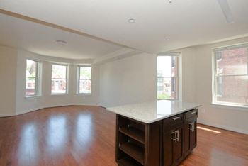 a kitchen with an island in the middle of a room