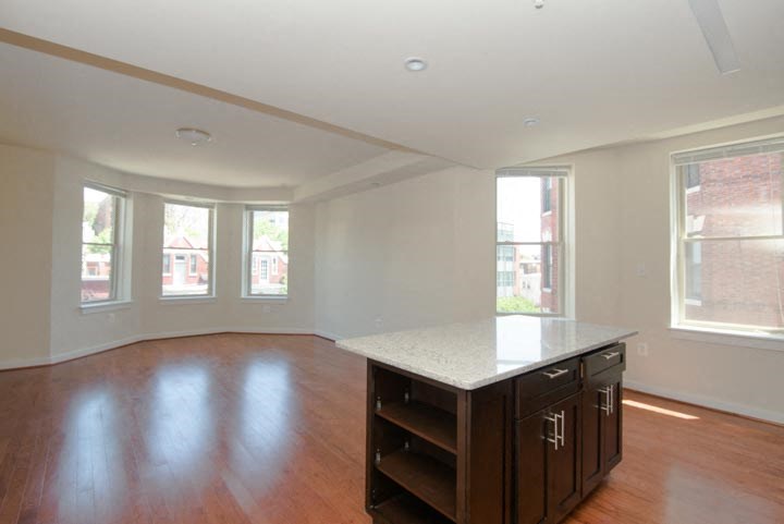 a kitchen with an island in the middle of a room