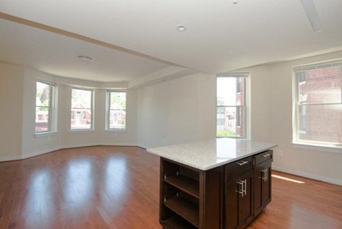 a kitchen with an island in the middle of a room