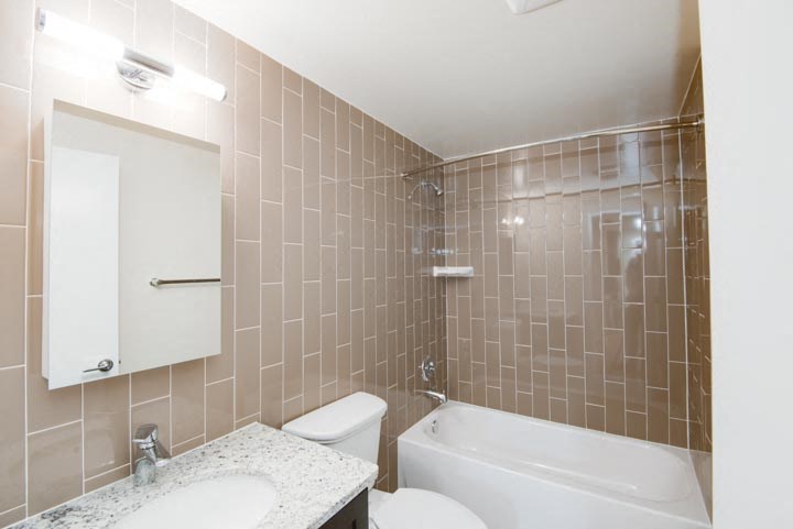 a bathroom with a sink toilet and bathtub