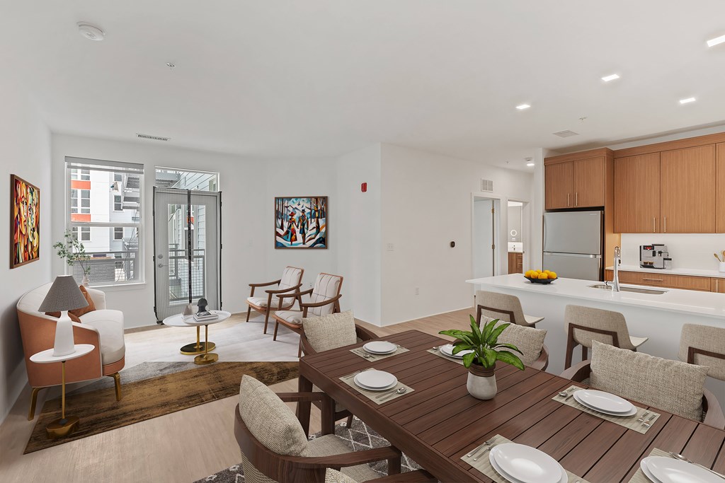 A modern dining room with a wooden table and chairs.