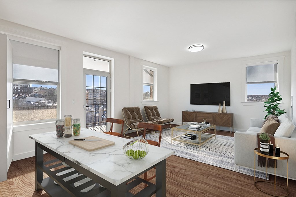 a living room with a table and a couch and a tv
