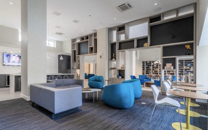 a large room with couches and chairs