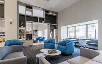 a living room with couches chairs and a coffee table at Carver and Slowe Apartments, Washington