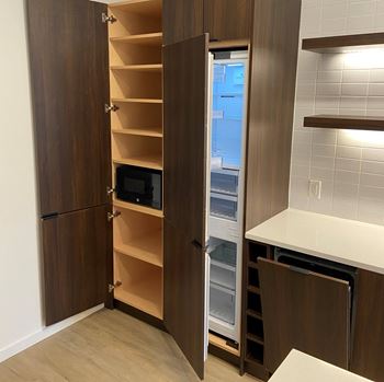 a kitchen with a refrigerator freezer and a sink