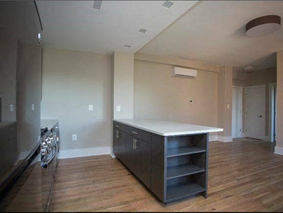a kitchen with a counter top and a stove