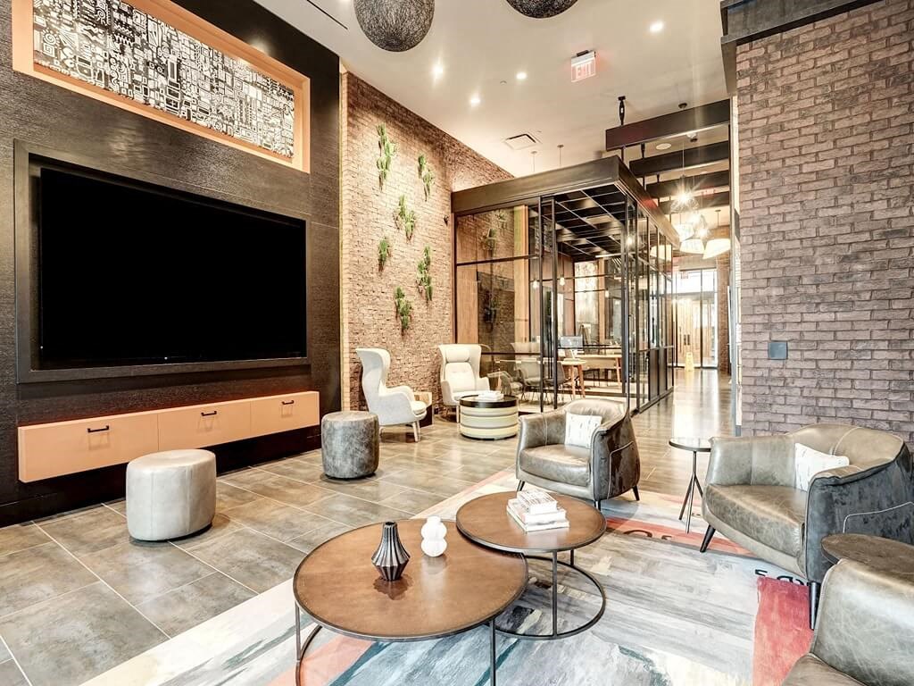 a living room filled with furniture and a large tv