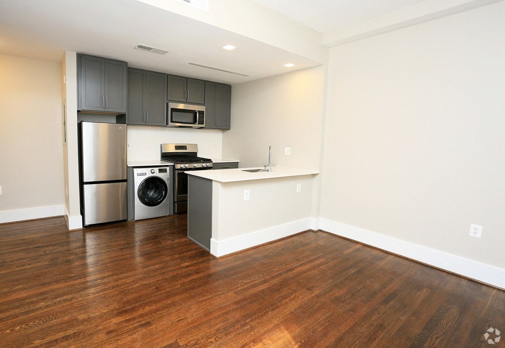 a kitchen and dining area in a 555 waverly unit