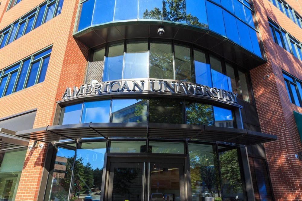 a tall building with a sign on the front of it