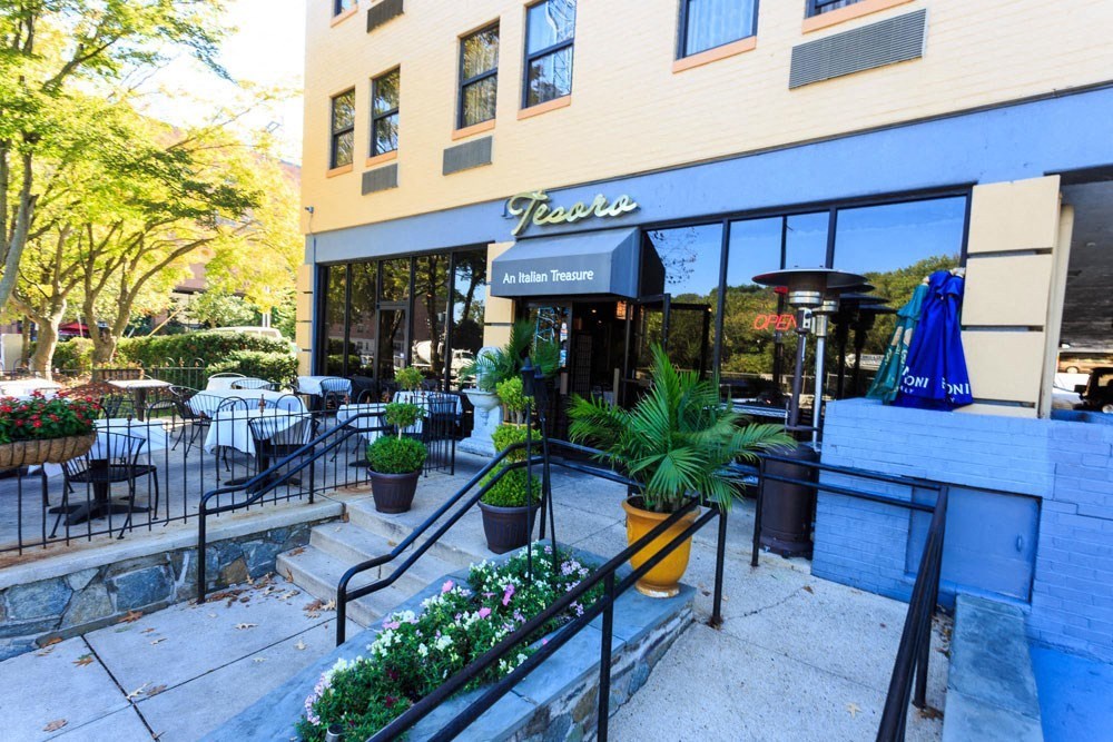 the outside of a restaurant with stairs and a patio at The Chesapeake Apartments, Washington, DC