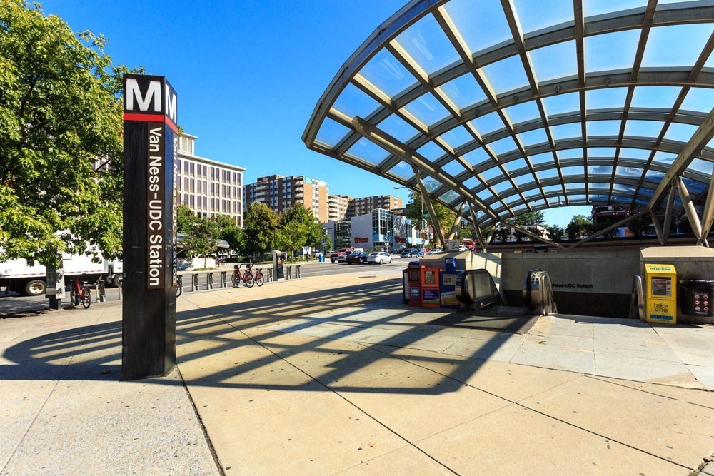 a metro station on the side of a city street at The Chesapeake Apartments, Washington, DC, 20008