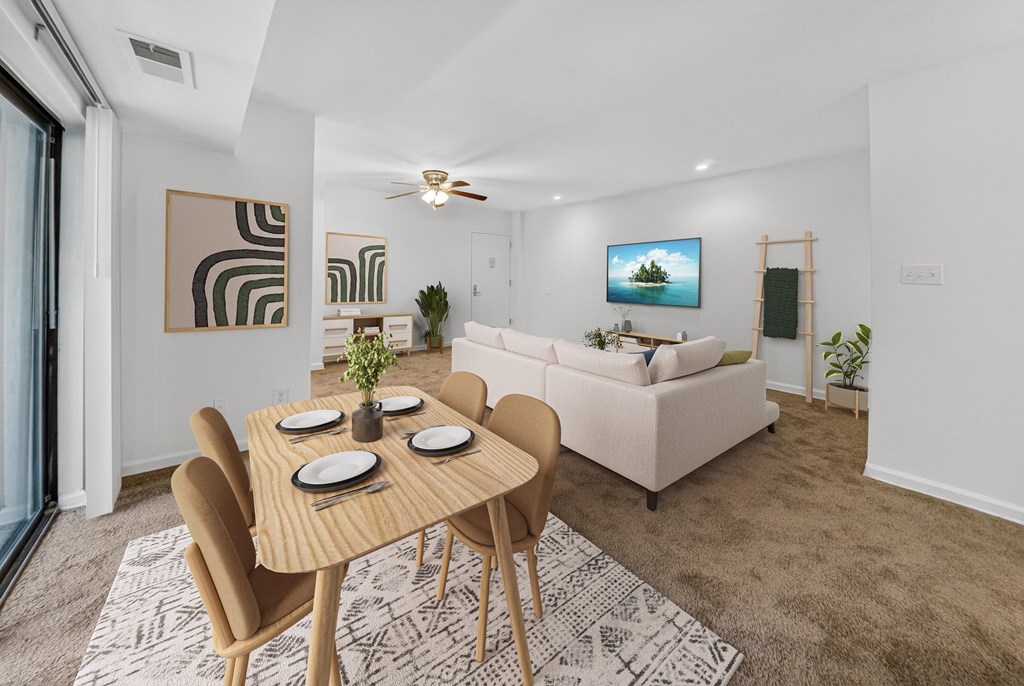 A modern dining room with a wooden table and chairs.