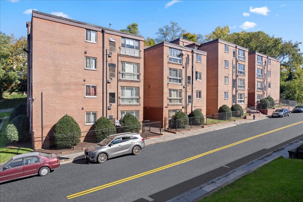 a view of an apartment building from the street