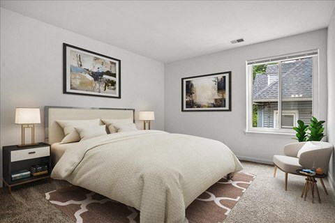 a bedroom with a bed and two windows