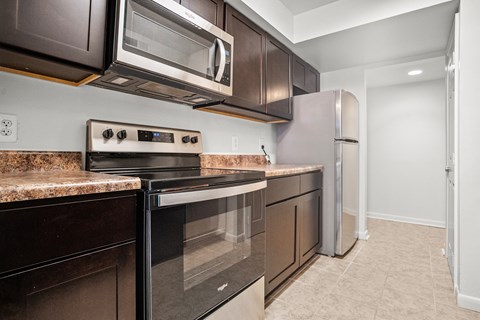 a kitchen with stainless steel appliances and granite counter tops