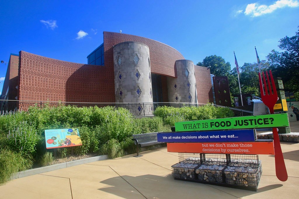 a sign in front of a building that says what is food justice