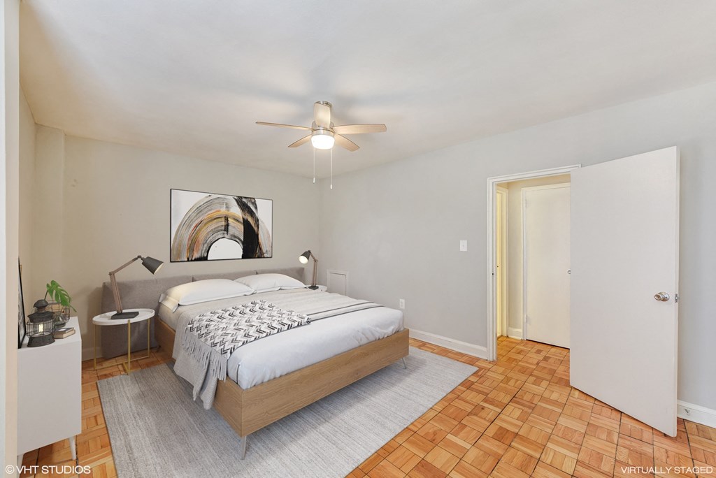 a bedroom with a bed and a ceiling fan at The Chesapeake, Washington at The Chesapeake Apartments, Washington, Washington DC