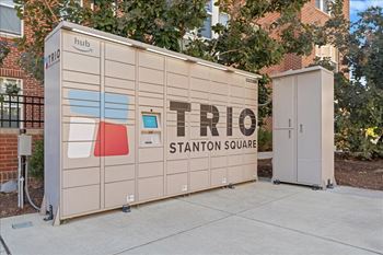 a small storage shed with the trio station square logo on it