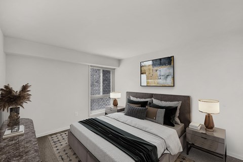 a bedroom with a large bed and a large window