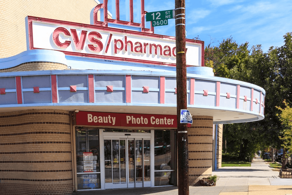 the front of a cvs pharmacy on a street corner