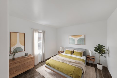 A bedroom with a bed, nightstand, and a painting on the wall.