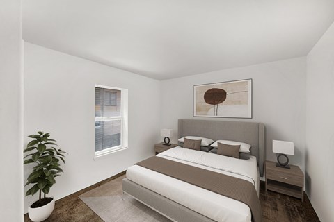 a bedroom with a bed and a potted plant