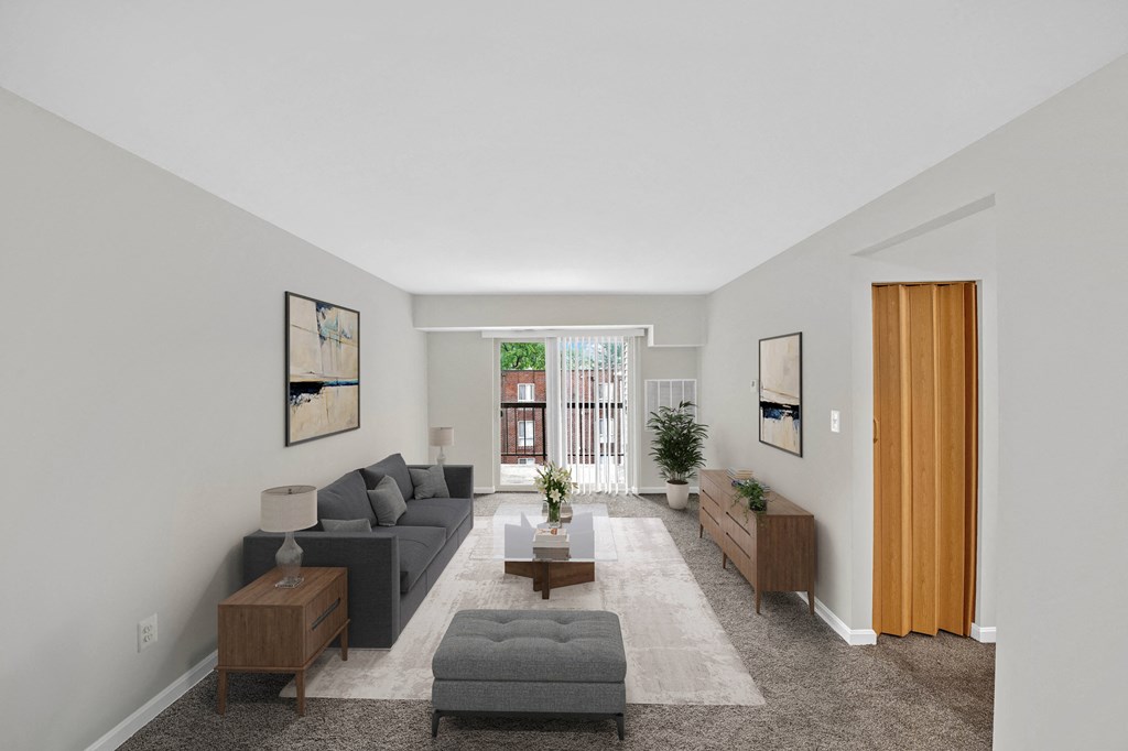 a living room with a gray couch and a coffee table