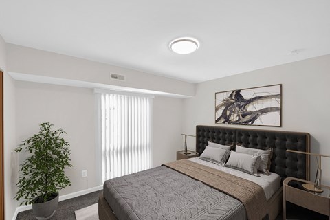 a bedroom with a bed and a plant