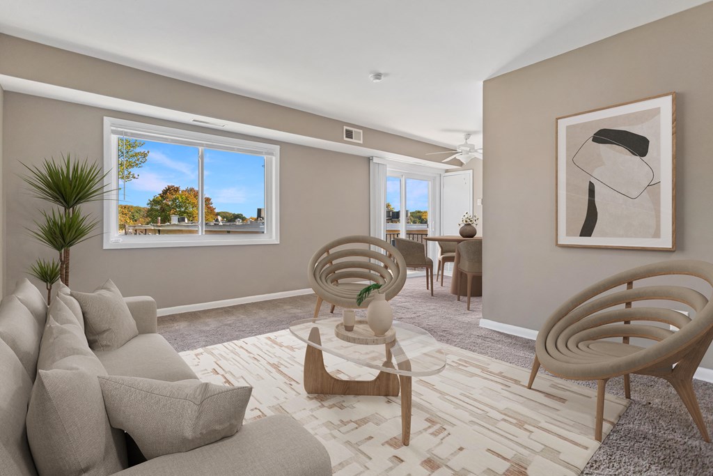 a living room with a couch and chairs