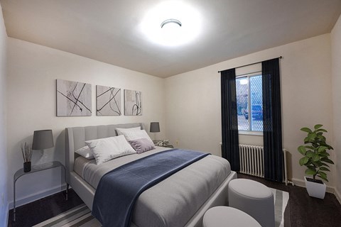a small bedroom with a bed and a window