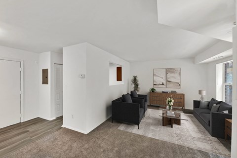 a living room with two couches and a coffee table