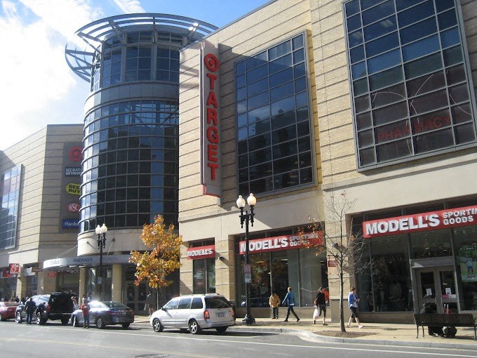 a large building on the corner of a city street