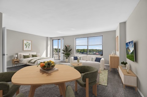 A modern living room with a dining table and chairs.