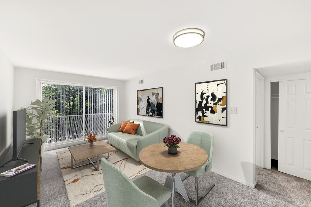 a living room with a couch and a table and chairs