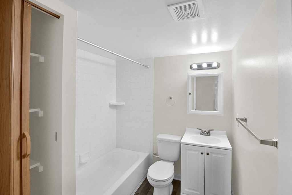 a bathroom with a sink toilet and a tub