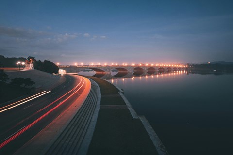 a bridge over a body of water at night