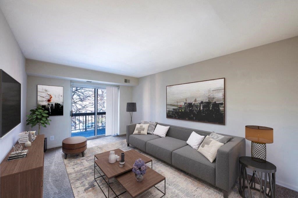 a living room with a gray couch and a table