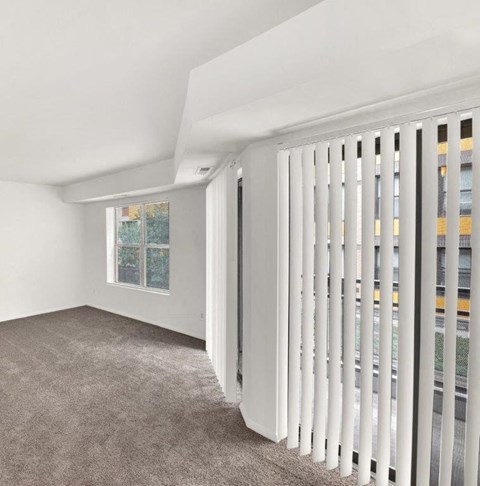 a living room with a white radiator and a window