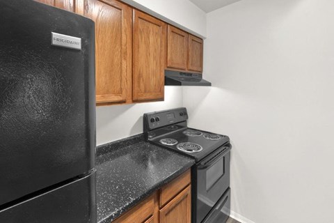 a kitchen with a stove and a refrigerator