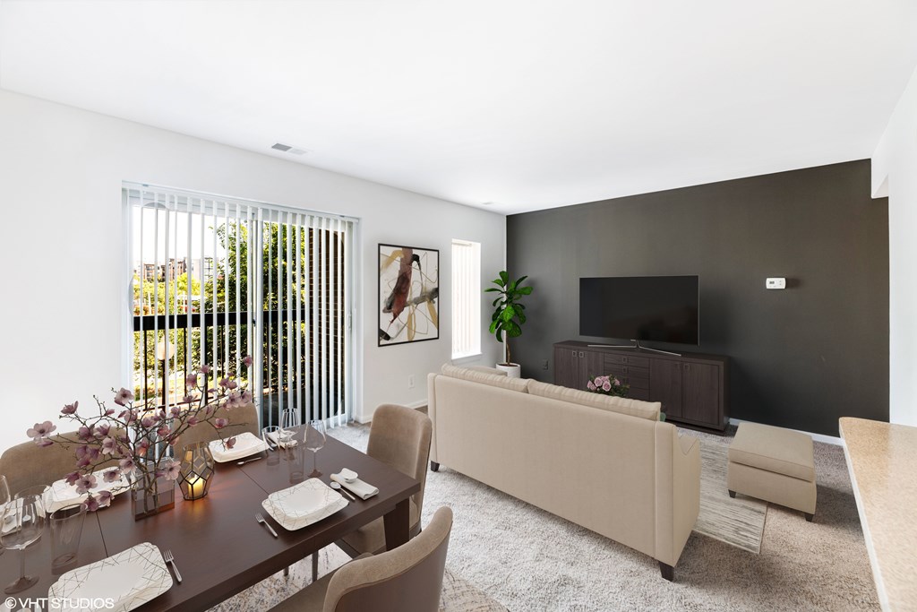 a living room with a table and a couch and a television