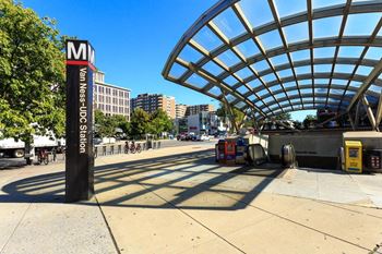 a metro station on the side of a city street at The Saratoga Apartments, Washington