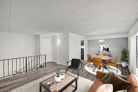 A living room with a brown couch and a coffee table.