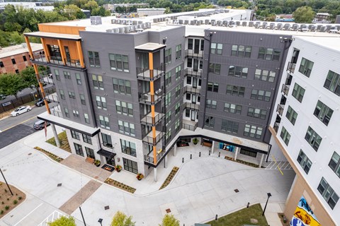 Aerial view of modern apartment courtyard with gray facade at The Yancey Apartments, Charlotte, NC 28217